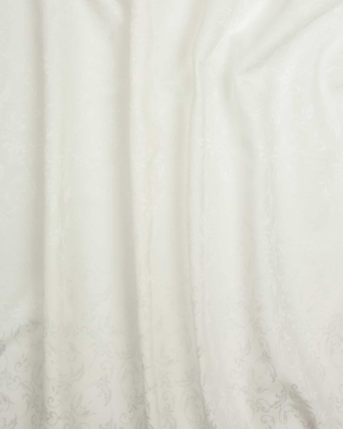 Flødefarvet med fint glansfuldt mønster, polyester